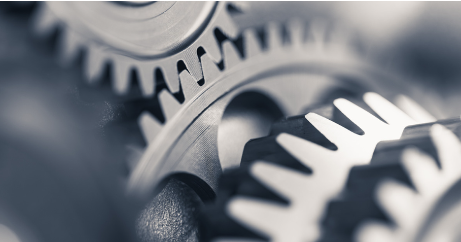 "Close-up of interlocking metal gears."