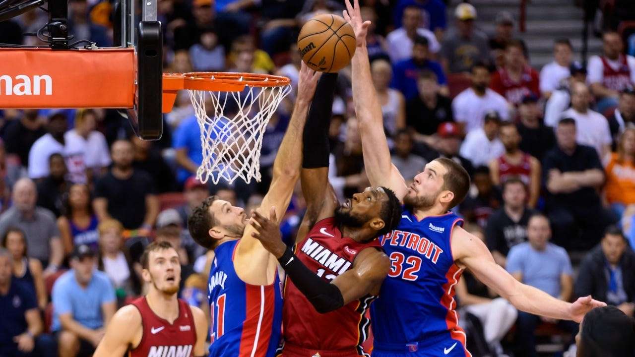 Miami Heat vs Detroit Pistons NBA game action on the court.
