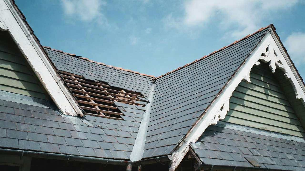 Sagging Victorian roof with missing slate tiles and corroded flashing issues
Image 3