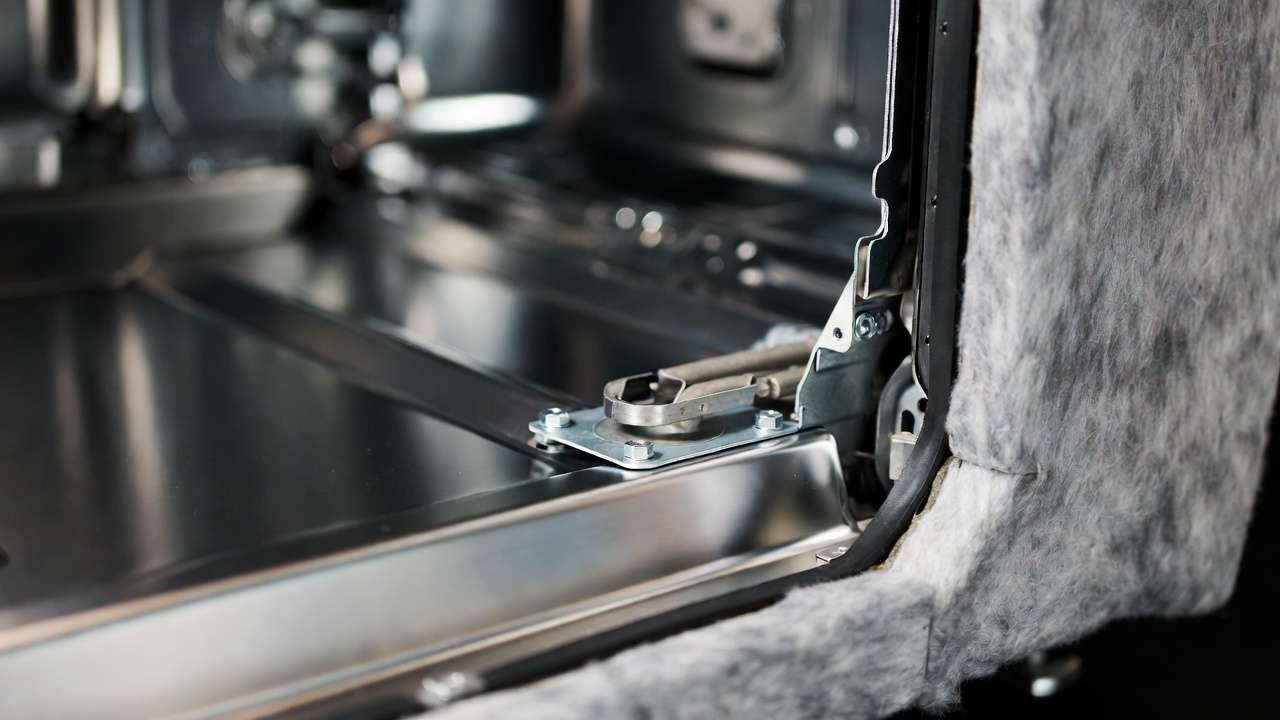 Stainless steel tub and corrosion-resistant materials in built-in dishwasher construction