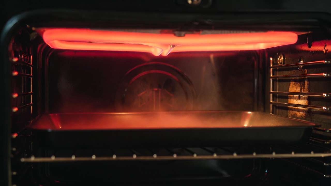 Oven broiler glowing red demonstrating radiation heat transfer in kitchen to mechanical engineering applications