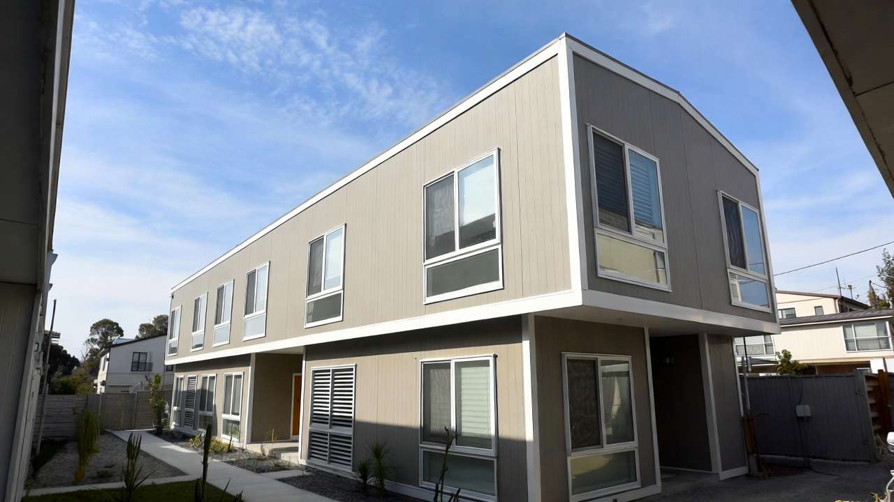 Completed modern two-story modular home exterior after full assembly